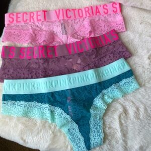 Set of three panties one pink, one purple and one teal.